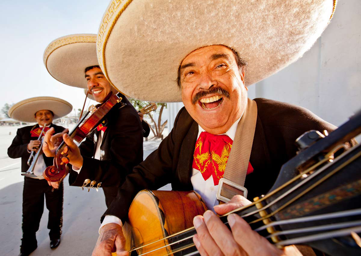 mariachi men playing music